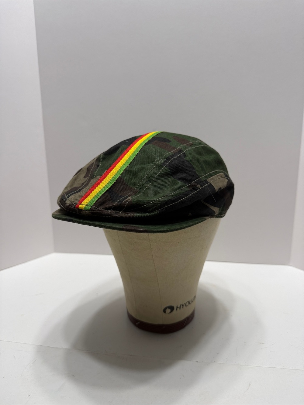 Men's Green Camo Flat Cap Rockers Its Dangerous with Red-Yellow-Green Stripe